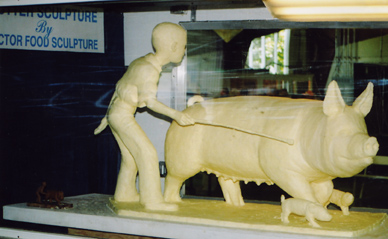 Boy with Pig by Jim Victor