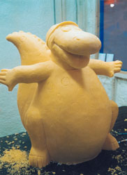 Cheese sculpture of cartoon dinosaur
