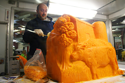 Jim Victor carving cheese at the Nebraaska State Fair
