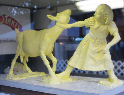 Butter sculpture of girl pulling goat by jim Scannell for Jim Victor Food Sculpture
