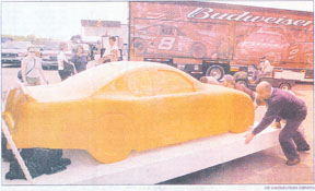 Terry Labonte's car carved in cheddar cheese for NASCAR by Jim Victor, Butter sculptor. Pushing the cheese car